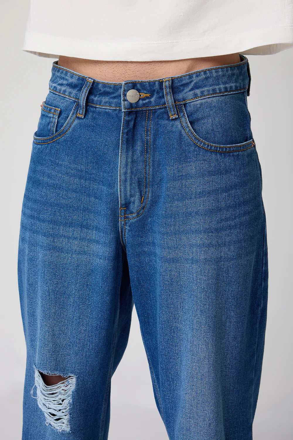Trendy Men's Urban Distressed Wide Fit Denim Jeans with Relaxed Streetwear Style