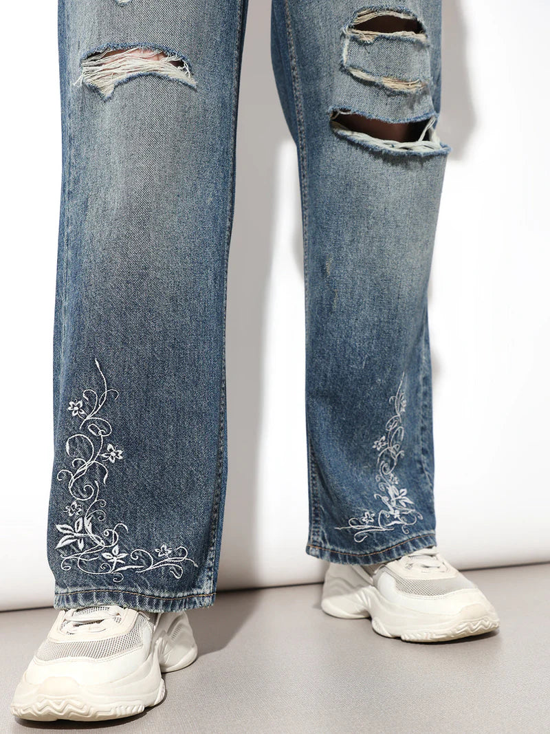 Modern Women’s Blue Distressed Jeans with Intricate Embroidered Details for Stylish Casual Outfits